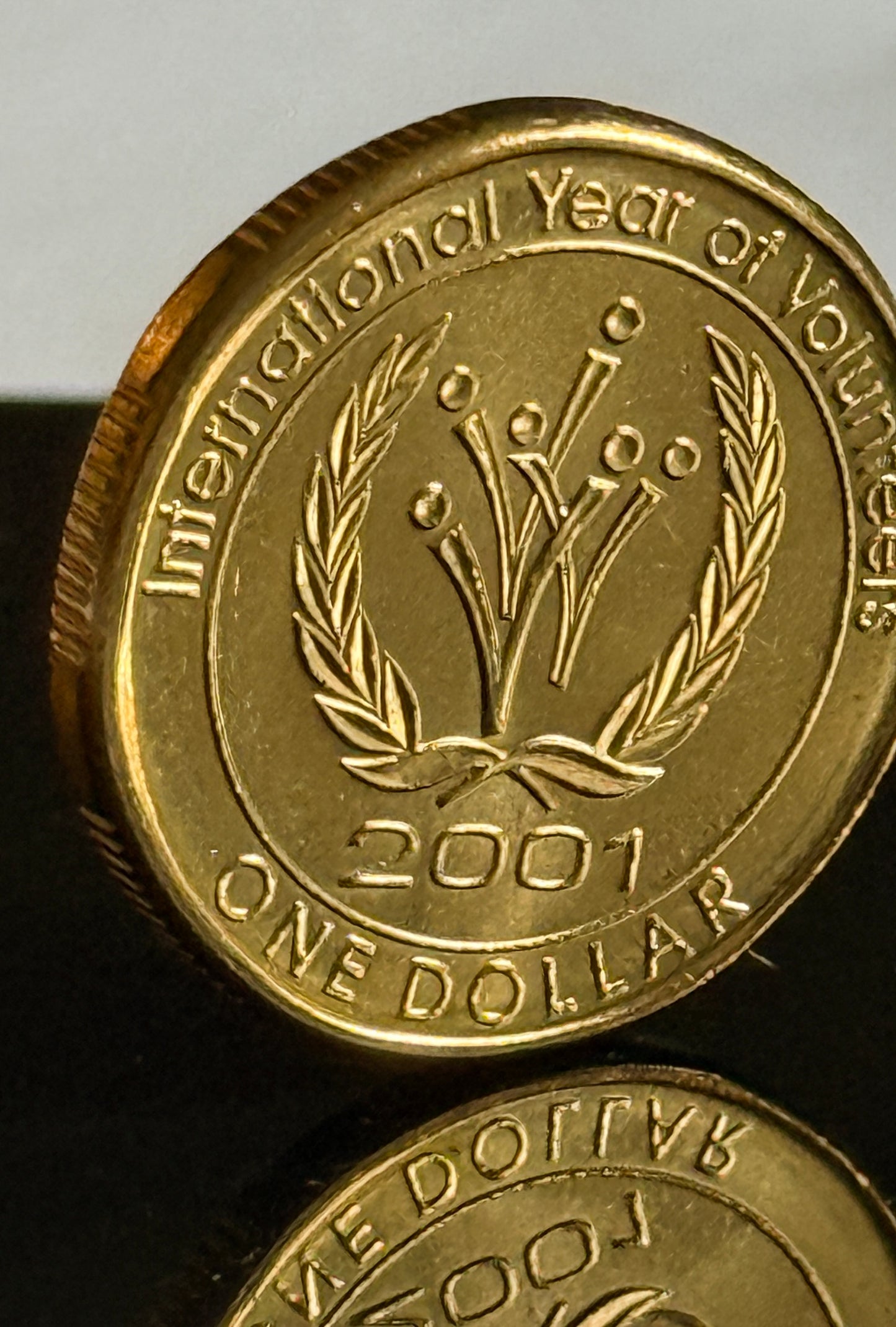 2001 $1 Year Of Volunteers Coin - Uncirculated - comes in 2x2