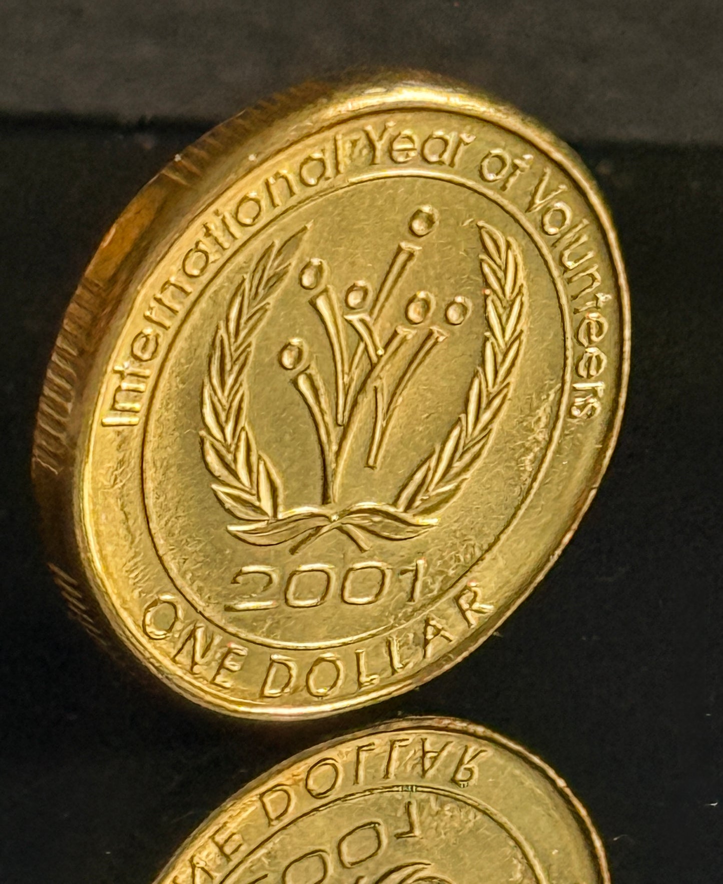 2001 $1 Year Of Volunteers Coin - Uncirculated - comes in 2x2