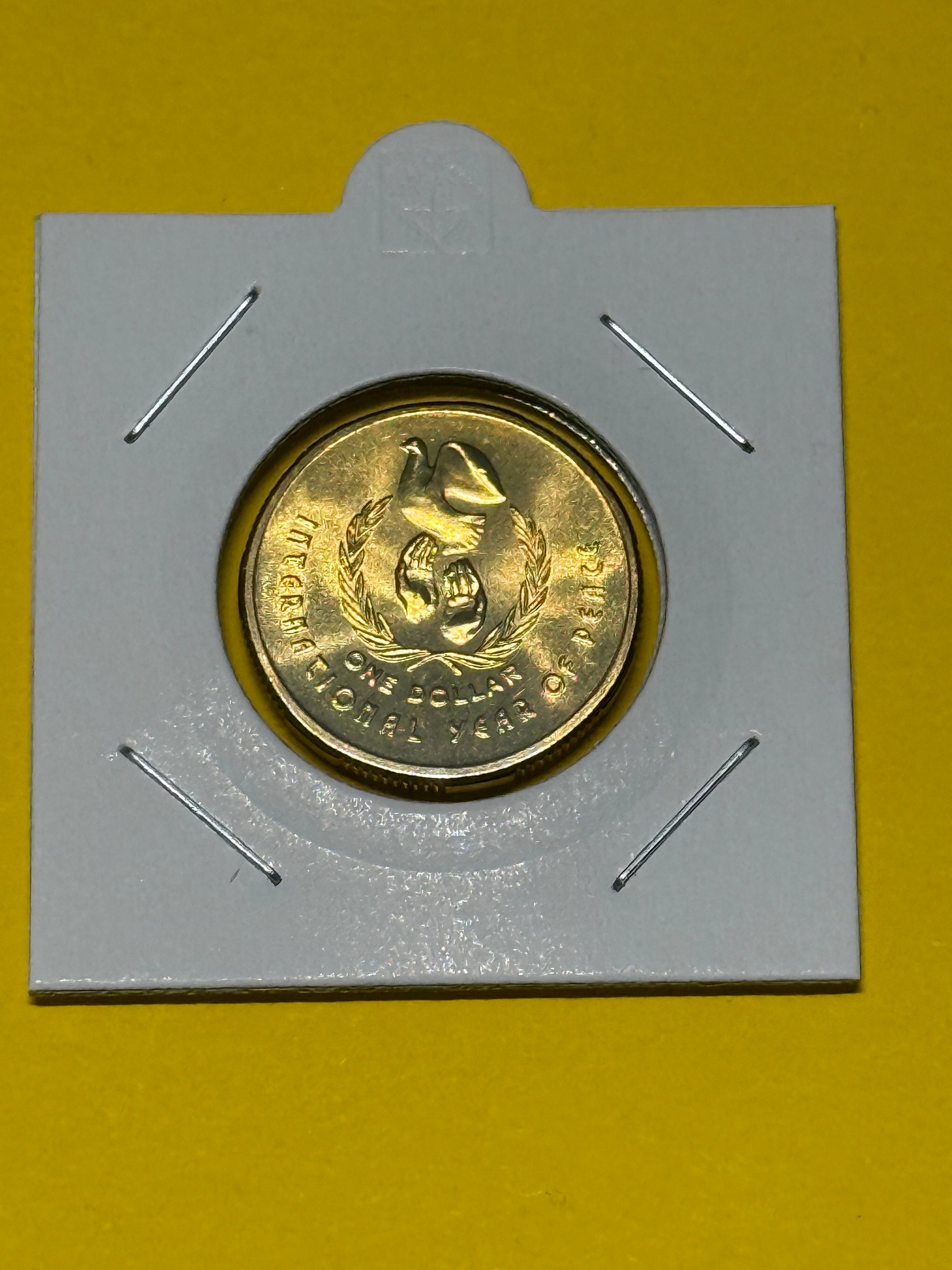 1986 $1 Coin - Year of Peace - Uncirculated - comes in 2x2 - New Age Numismatics