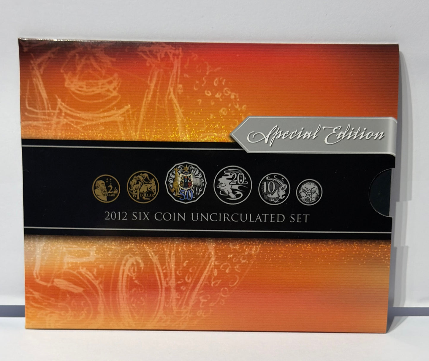 Special Edition 2012 Six Coin Uncirculated Set packaging with coins on an orange and black background.