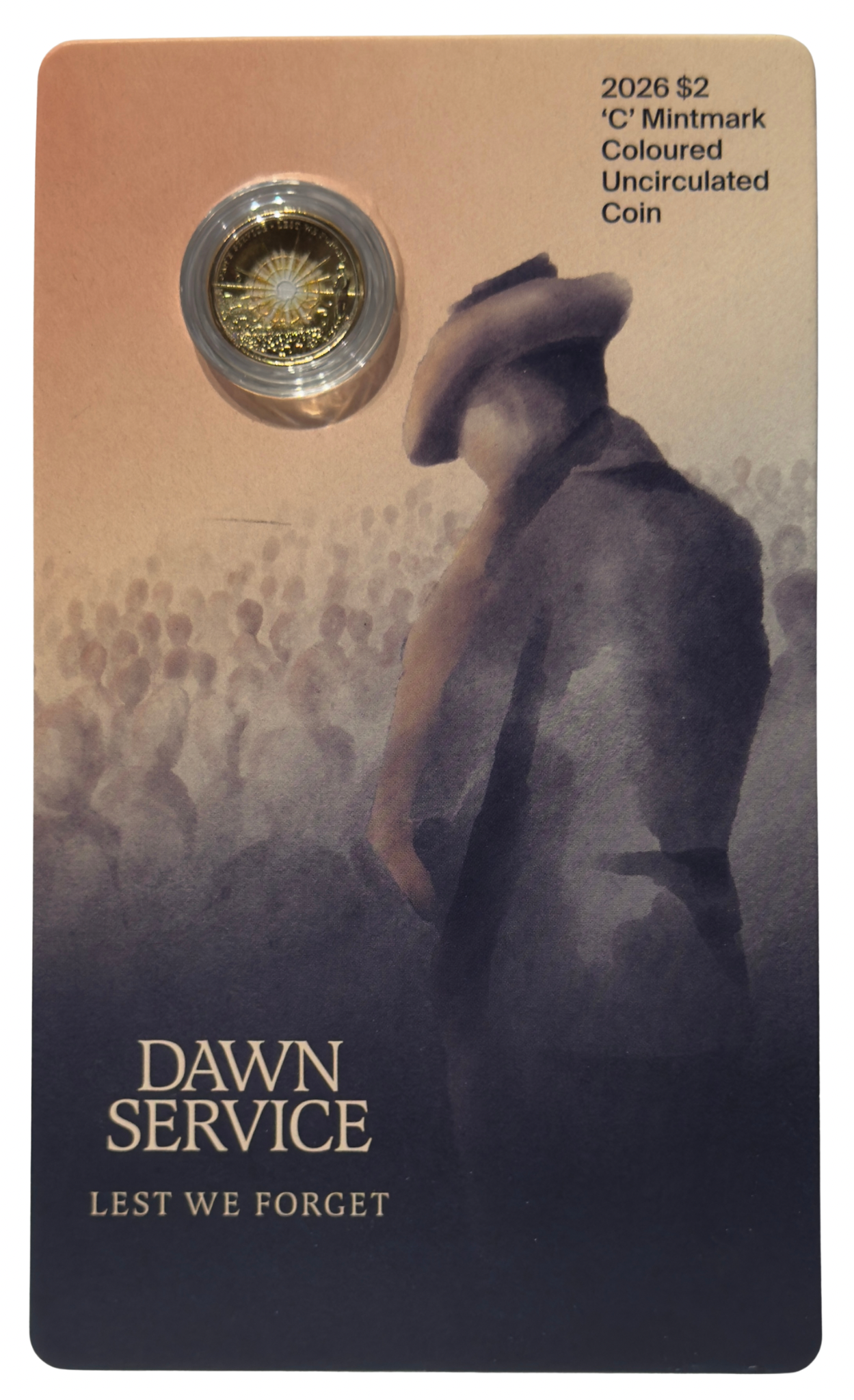Coin card with a gold coin and a person in uniform, featuring text 'Dawn Service Lest We Forget'.