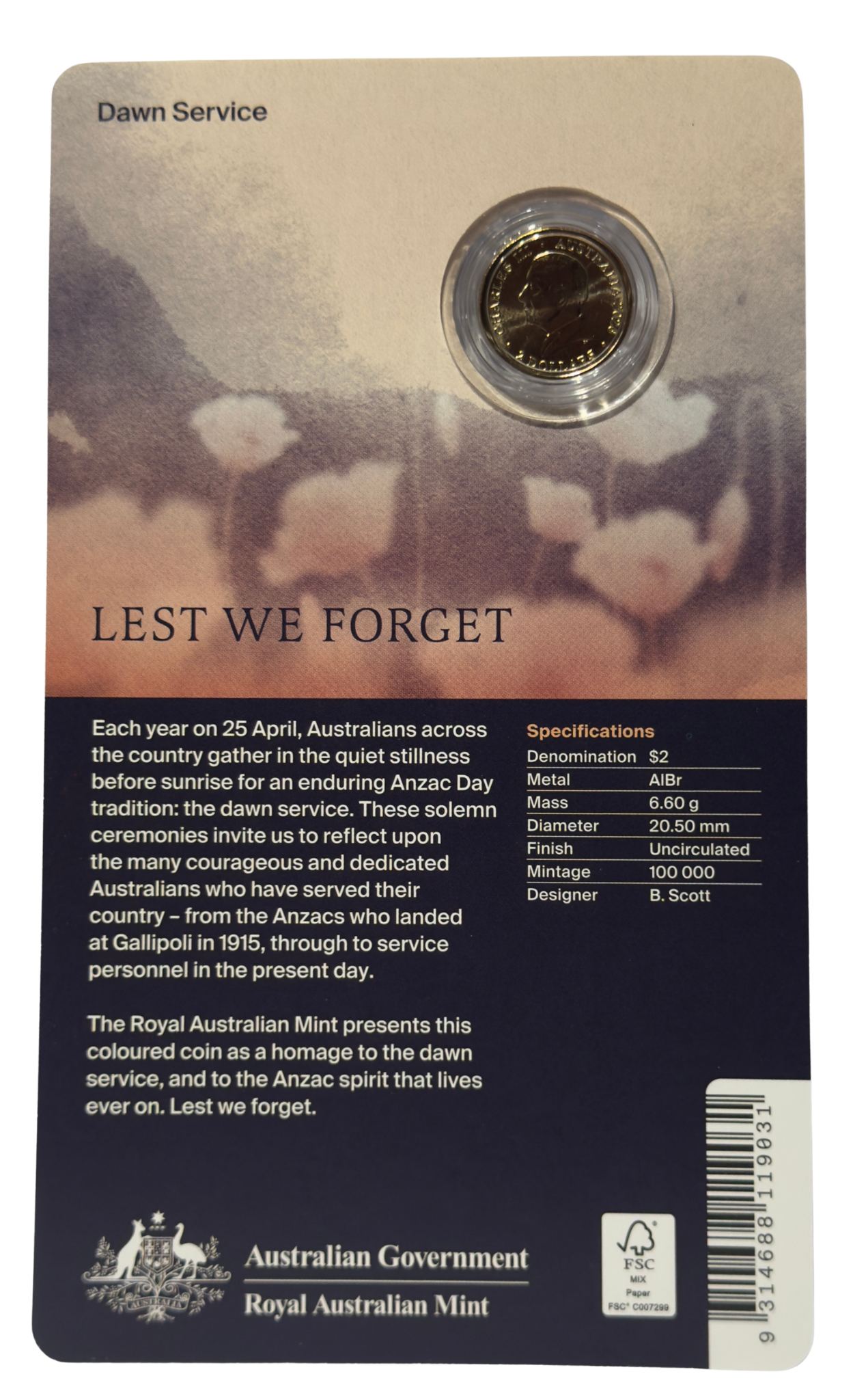 Coin on a card with 'Lest We Forget' text and design
